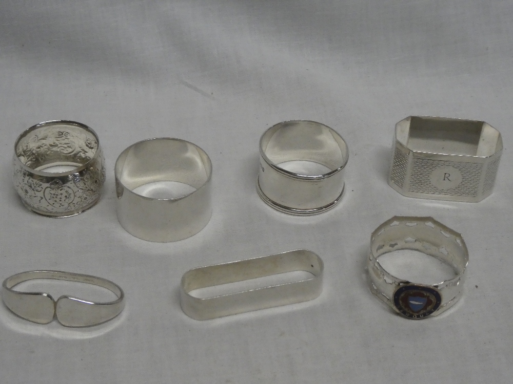 Five various silver napkin rings,