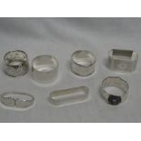 Five various silver napkin rings,