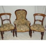 Five matching Victorian mahogany dining chairs with carved rail backs and tapestry upholstered