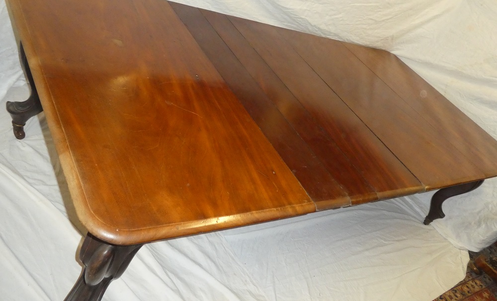 A mid Victorian figured mahogany extending dining table with three additional centre leaves on - Image 2 of 3