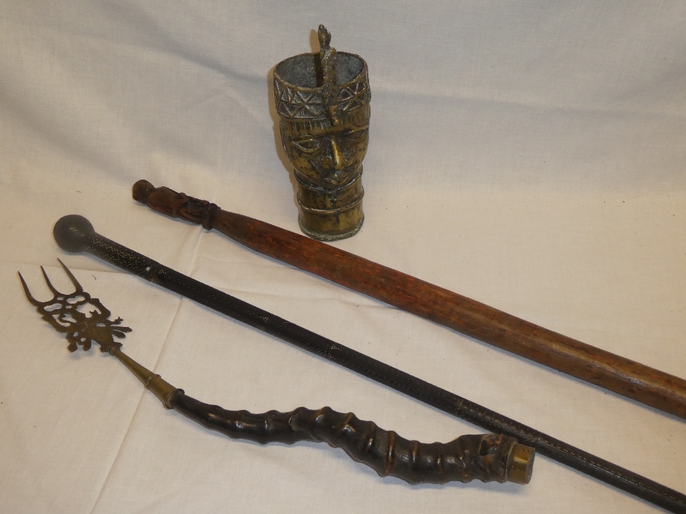 Two various African carved wood walking canes,