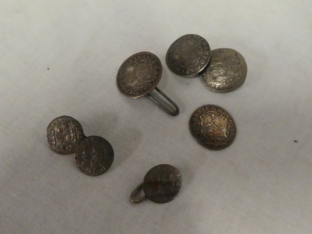 A pair of silver cufflinks made from early coins and one other part pair of coin cufflinks