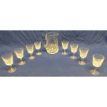 A set of eight Waterford cut crystal wine glasses together with a similar Waterford crystal water