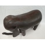 A rare Liberty & Co brown leather covered footstool in the form of an elephant,