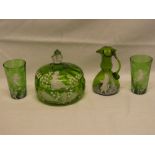 Four pieces of green tinted Mary Gregory-style glass including powder jar and cover,