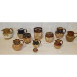 A selection of 19th Century and later stoneware pottery including Royal Doulton cylindrical