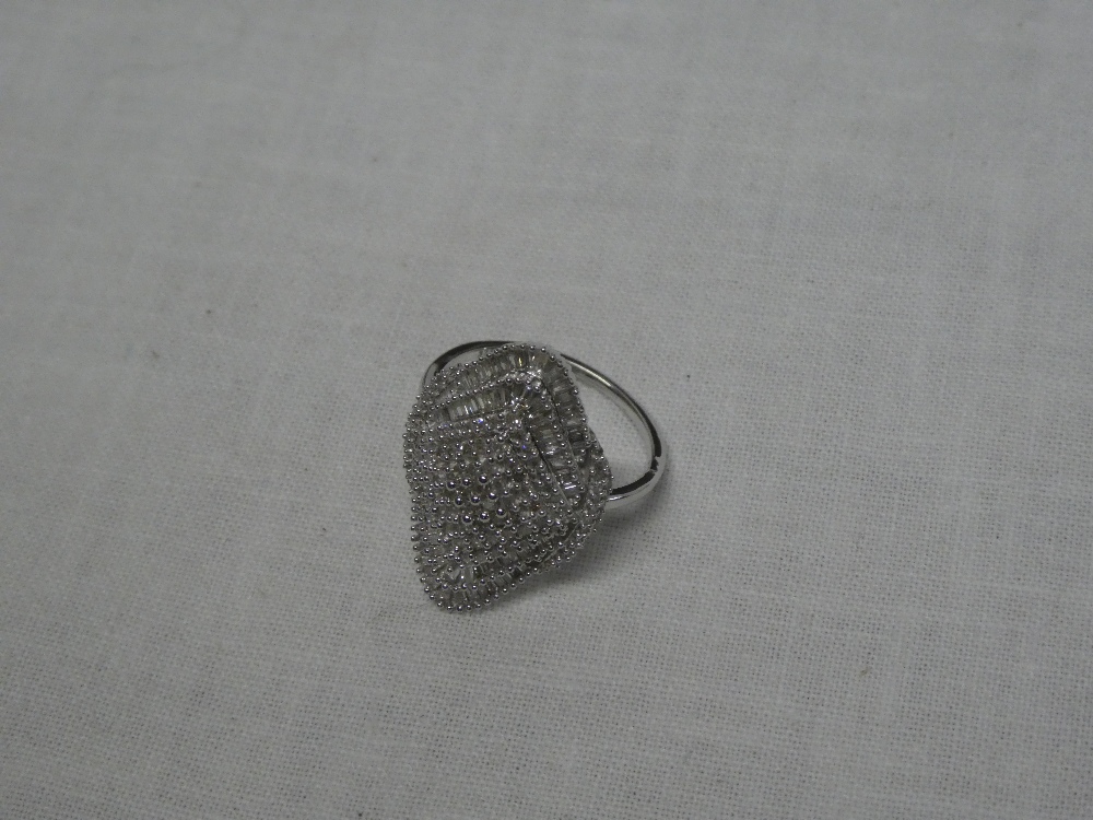 A 9ct white gold lozenge-shaped dress ring set numerous diamonds