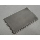 A good quality silver rectangular slide-opening cigarette case with engine turned decoration,