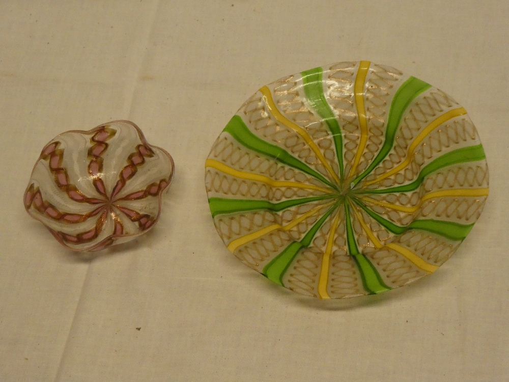 An unusual Venetian glass circular bowl with green and yellow striped decoration and one other