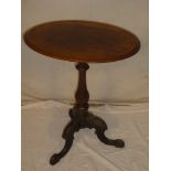 A Victorian mahogany oval occasional table on turned column with tripod base