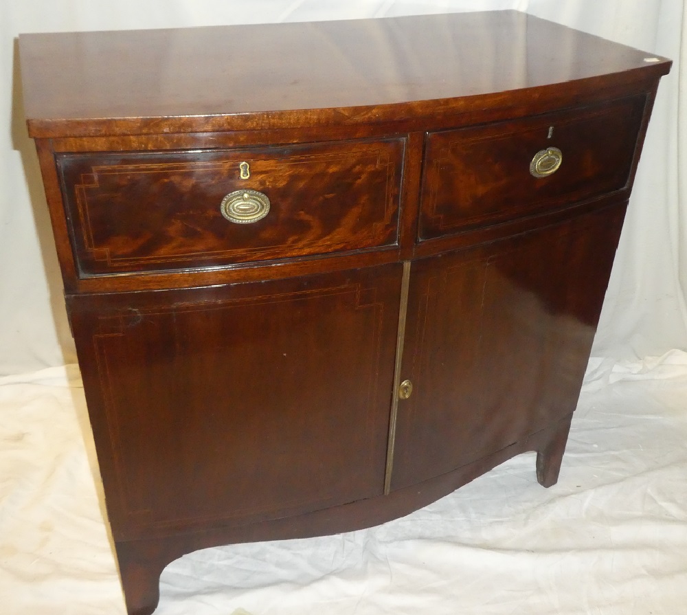 A 19th century mahogany bow front side cupboard with two drawers in the frieze and cupboard