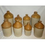 Eight various 19th century stoneware flagons from Croydon including two gallon flagon by T L
