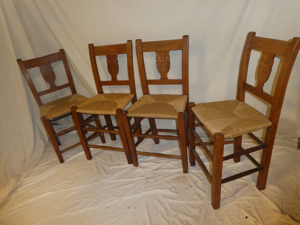 A set of four 19th century Continential elm dining chairs with vase splat backs and rushwork seats