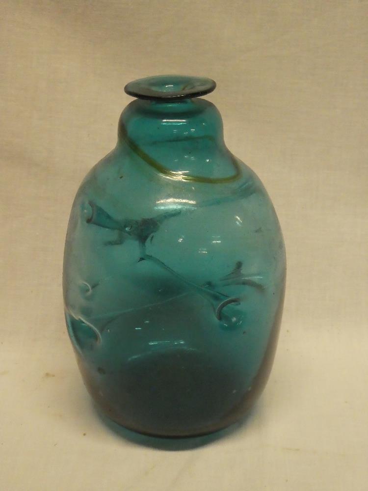 An unusual blue tinted glass tapered vase with internal strands,