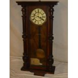 A good quality Vienna regulator wall clock with decorated circular dial in polished mahogany