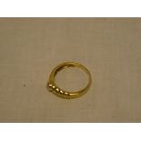 An 18ct gold dress ring with rope-twist mount set a single diamond