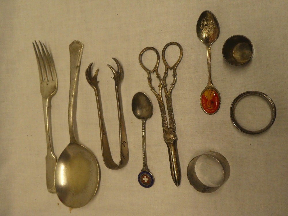 A silver-plated grape scissors, silver Swiss Sports London 1938 spoon,