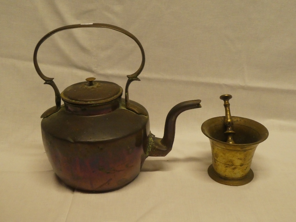 A 19th Century copper circular kettle with scroll handle and cover and an early bronze mortar and