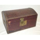 A good quality brass mounted Morocco leather domed travelling box with inset handles and hinged lid