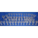 A part suite of 19th century drinking glasses comprising nine 6" wine glasses with etched vine
