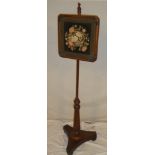 A 19th Century mahogany pole screen with square needlework tapestry panel on trefoil base