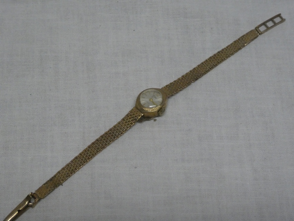 A lady's 9ct gold wristwatch by Sitra with 9ct strap