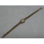 A lady's 9ct gold wristwatch by Sitra with 9ct strap