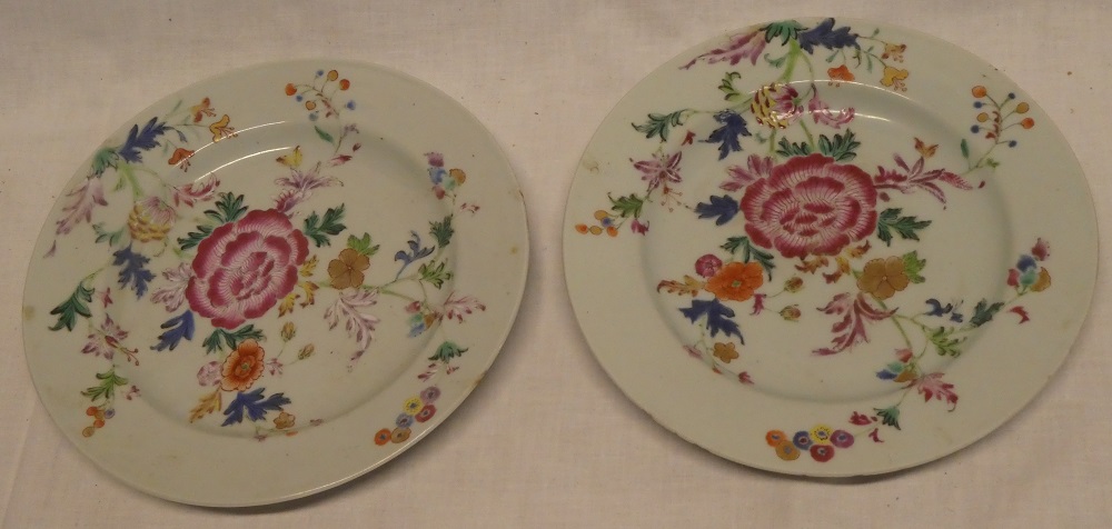 A pair of early 19th Century Famille Rose circular plates with floral decoration,