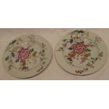 A pair of early 19th Century Famille Rose circular plates with floral decoration,