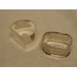 A good quality silver semi-circular napkin ring and one other silver engine turned napkin ring (2)