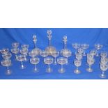 A suite of Edwardian drinking glasses and decanters including three globular shaped decanters with