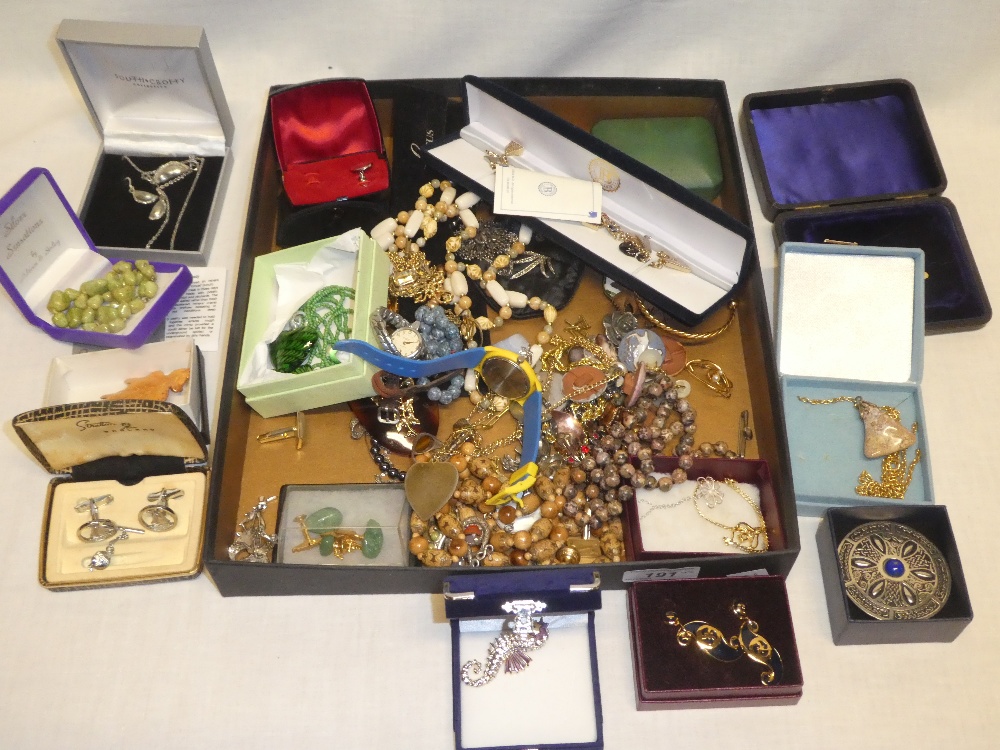 A quantity of costume jewellery including necklaces, brooches, wrist watches etc.