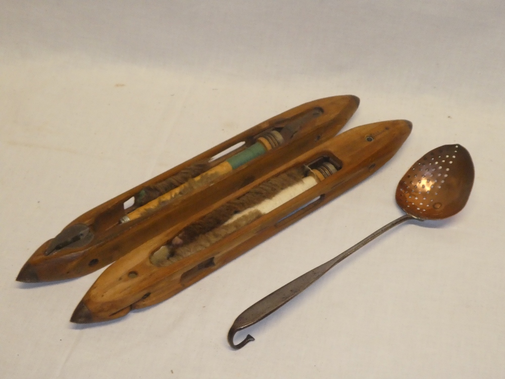A pair of old German wooden weaving shuttles and a 19th Century copper ladle with iron handle