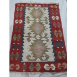 An Eastern flat-weave rectangular wool rug with geometric decoration 56" x 44"