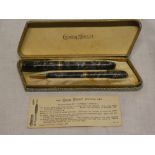 A Conway Stewart fountain pen and pencil writing set with marbled cases in original box