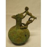 A Roman-style weathered bronze tapered jug with figure decorated handle 8" high (af)
