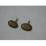 A pair of 9ct gold oval cufflinks with pierced decoration