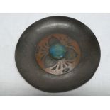 An unusual copper Art Nouveau circular dish with decorated centre and raised turquoise ceramic