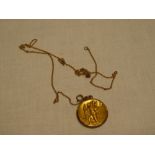 A 9ct gold mounted circular St Christopher pendant with chain