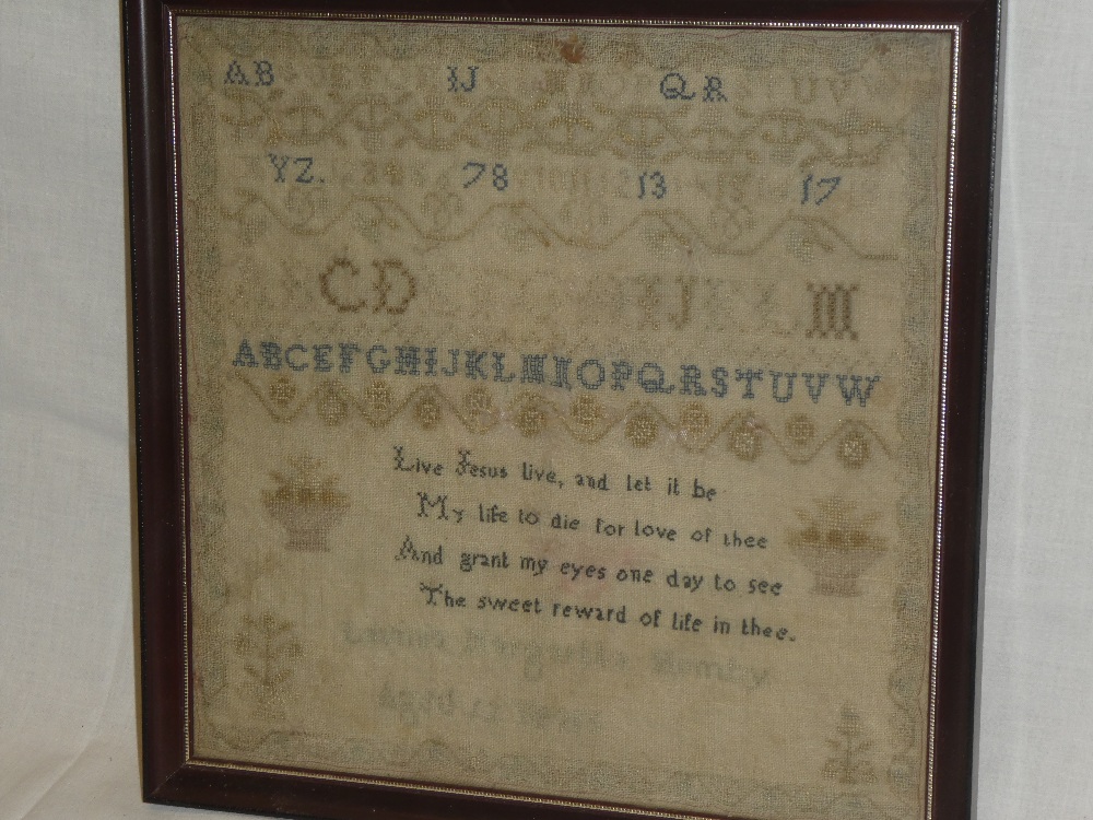 A 19th century needlework sampler by Lavinia Margaretta Humby aged 10 years depicting numerals,