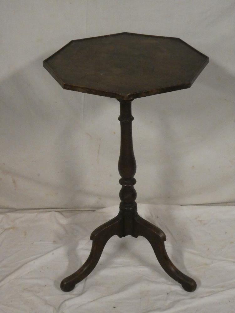 A 19th century mahogany octagonal occasional table on turned column with tripod base