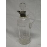 A late Victorian cut glass cylindrical claret jug and stopper with silver mounted neck and spout,