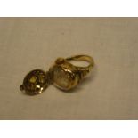 A lady's gold-plated dress ring with mount opening to reveal a miniature watch by Bessa