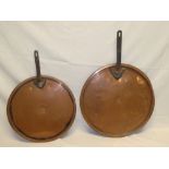 Two large 19th Century copper circular saucepan lids with iron handles