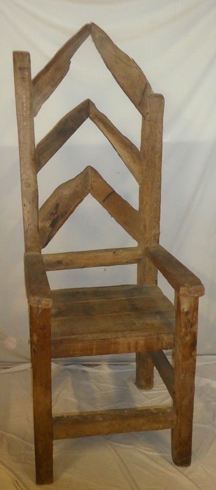 An unusual large reclaimed timber open arm throne chair marked "Cody",