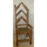 An unusual large reclaimed timber open arm throne chair marked "Cody",