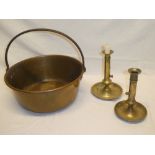 Two various 19th century brass ejector candlesticks with circular dished bases and an old brass