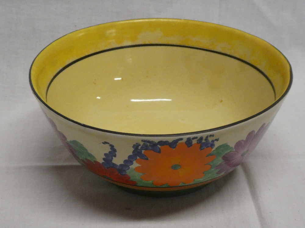 A Clarice Cliff Bizarre "Gayday" pattern circular bowl with painted floral decoration (slight