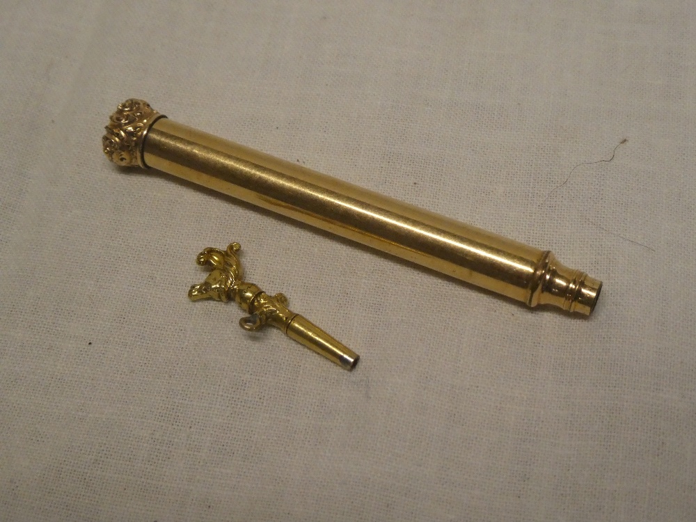 A rolled gold propelling pencil by W Hicks of New York and an unusual miniature pocket watch key