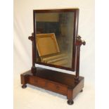 A Victorian mahogany rectangular toilet mirror with turned columns on rectangular base with two
